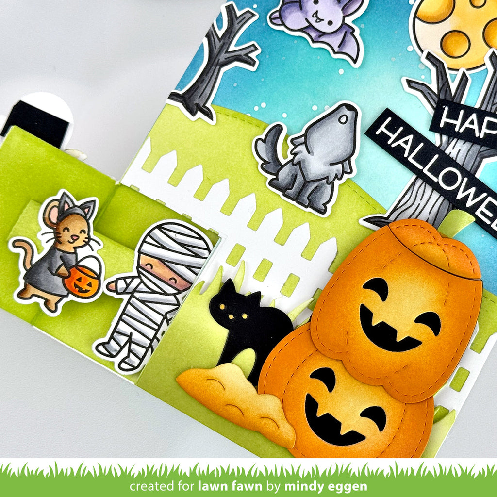 Halloween-themed card with pumpkins, cat, and mummy stickers on a white background. | color-code:alt1