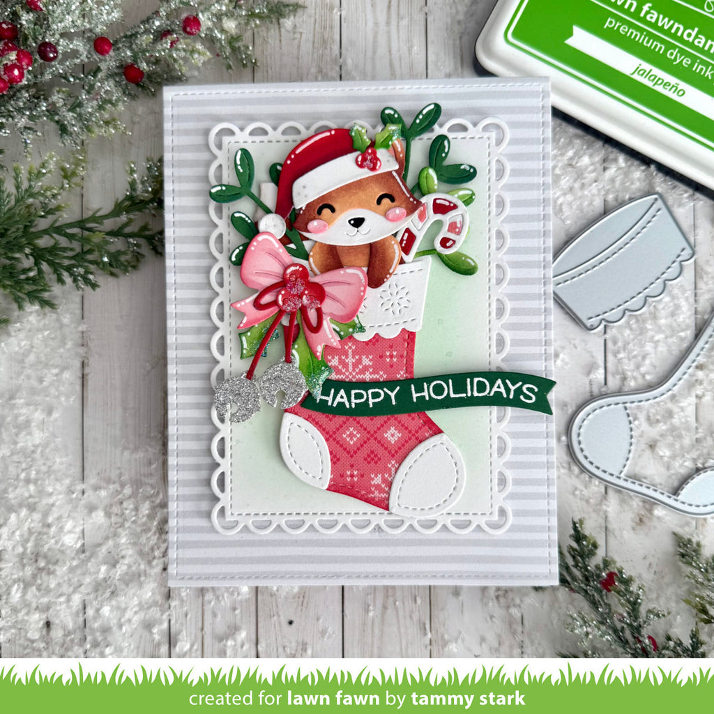 Christmas-themed card with a fox in a stocking and 'Happy Holidays' text, surrounded by festive decorations.