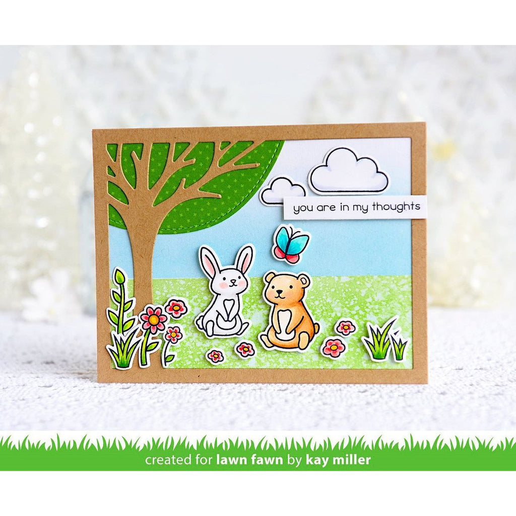 Card with bear, rabbit, butterfly, tree, and cloud with 'you are in my thoughts' message on a white background.