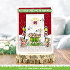 Christmas card with cartoon mice singing and festive text on a wooden stand.