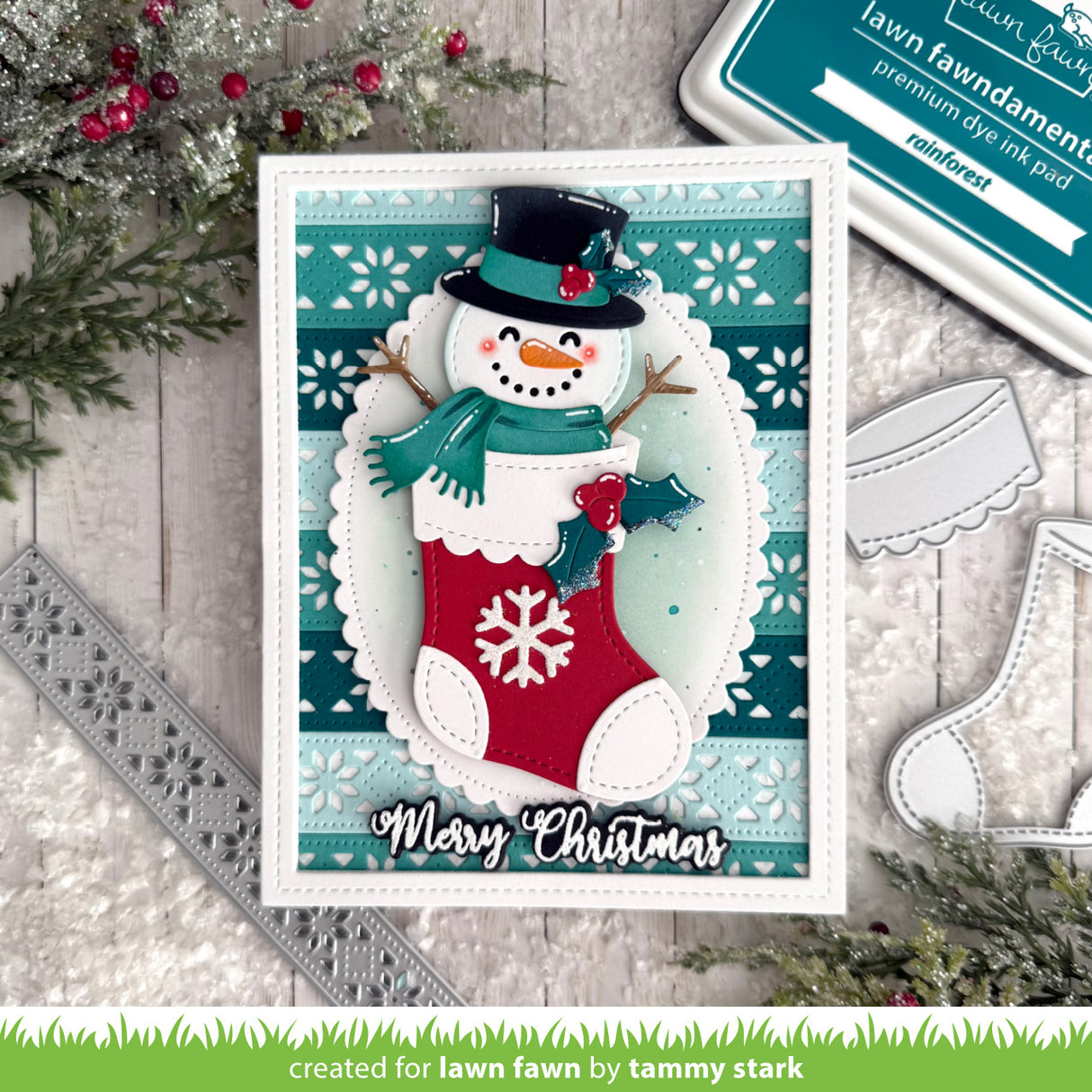 Christmas card with a snowman in a stocking and 'Merry Christmas' text, surrounded by festive decor.