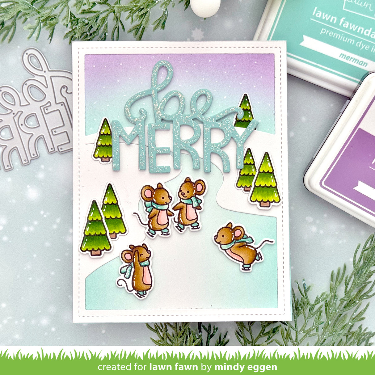 Holiday card with mice and trees on a gradient background, surrounded by crafting tools.
