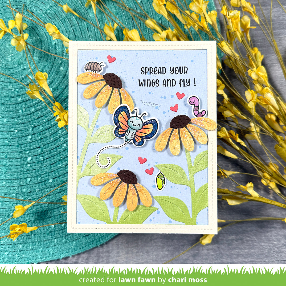 Card with butterfly and flowers design, surrounded by yellow flowers