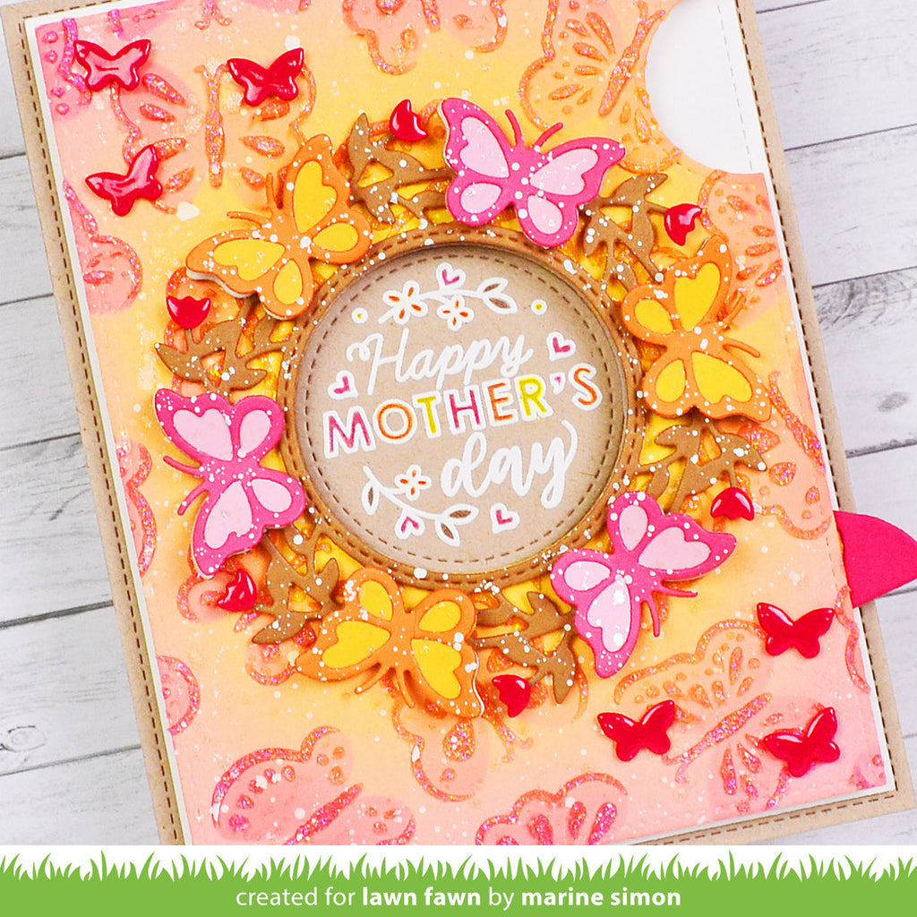 Decorative card with 'Happy Mother's Day' text and butterflies on a wooden surface.