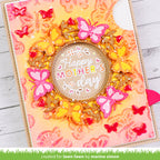 Decorative card with 'Happy Mother's Day' text and butterflies on a wooden surface.