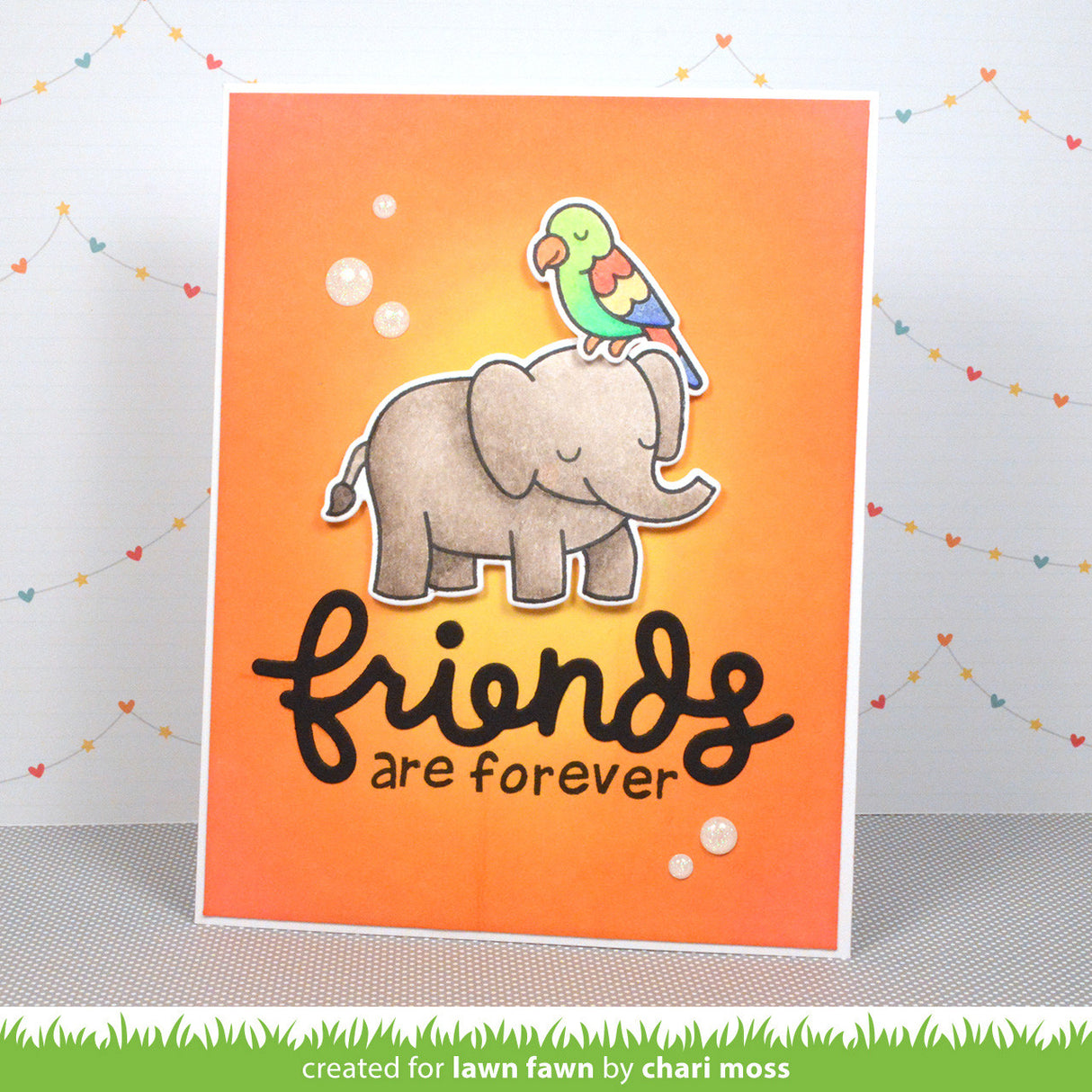 Card with an elephant and parrot illustration and 'friends are forever' text on an orange background.