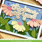 Card with 'Thinking of you' text and floral designs on a blue background