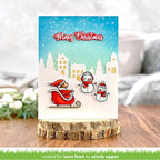 Christmas card with Santa, reindeer, and snowman on a wooden stand with a blurred background