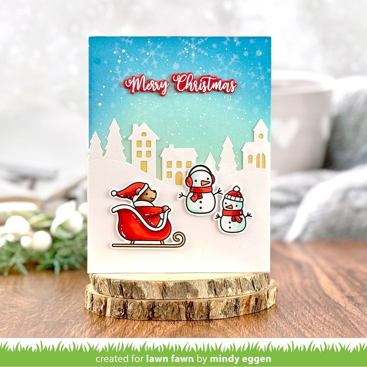 Christmas card with Santa, reindeer, and snowman on a wooden stand with a blurred background