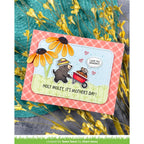 Mother's Day card moles in a wheelbarrow, surrounded by yellow flowers and a red gingham background