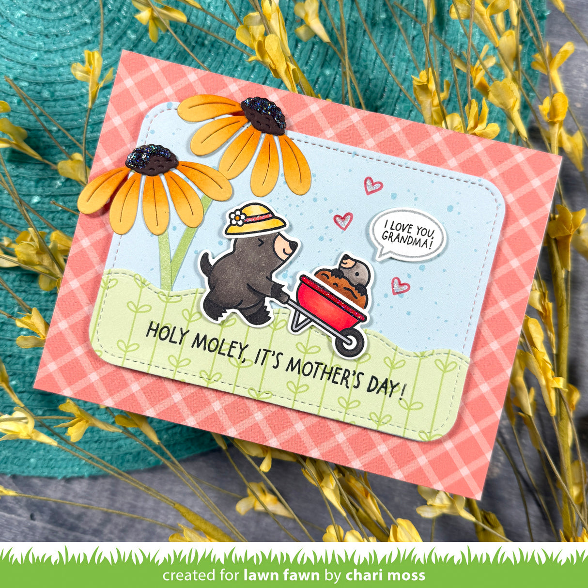 Mother's Day card with mole, flowers, and text on a checkered background including sentiment 'i love you grandma'