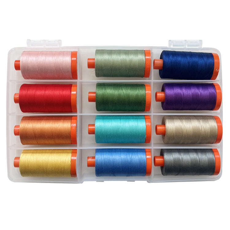 Palette Set of colorful sewing thread spools in a clear plastic case on a white background