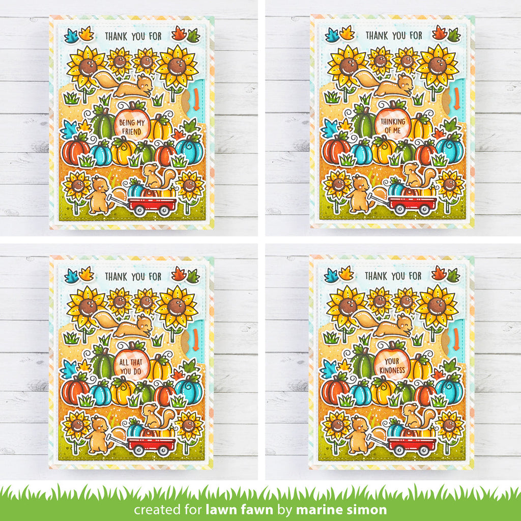 Four identical cards with autumn-themed illustrations on a wooden surface.