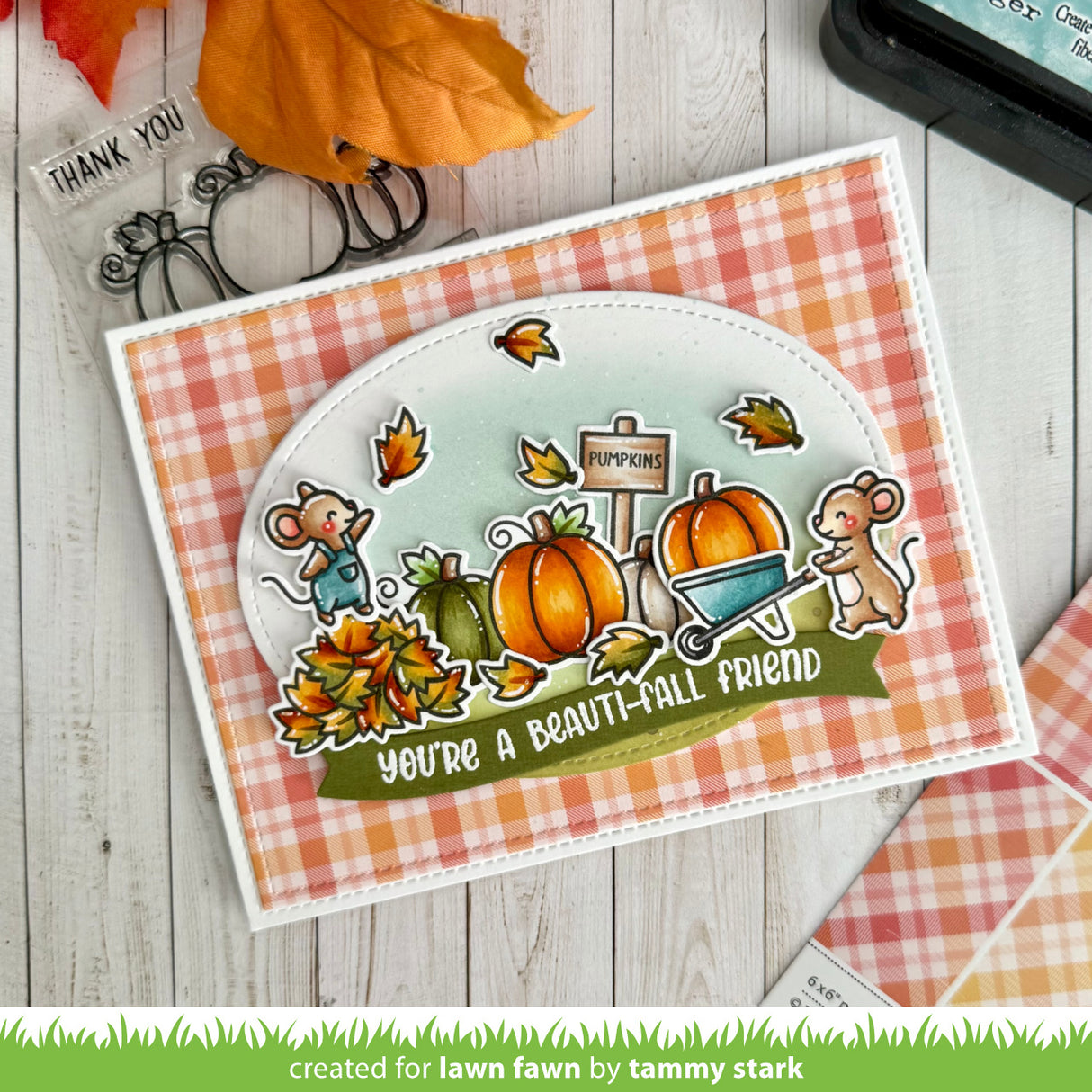 Autumn-themed card with pumpkins and mice on a checkered background