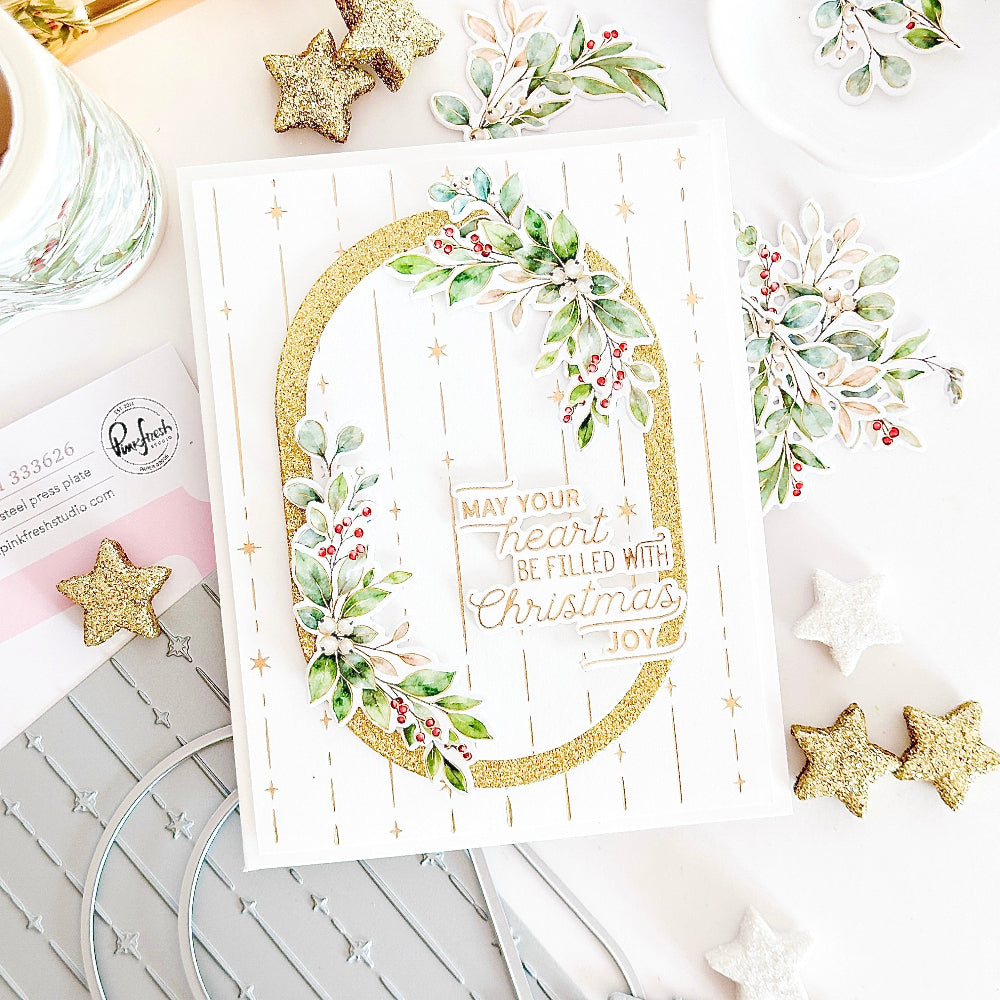 Pinkfresh Studio Seasonal Sprigs Clear Stamps Dies Stencils And Washi Bundle May your hear be filled with Christmas joy celestial oval and winter greenery card