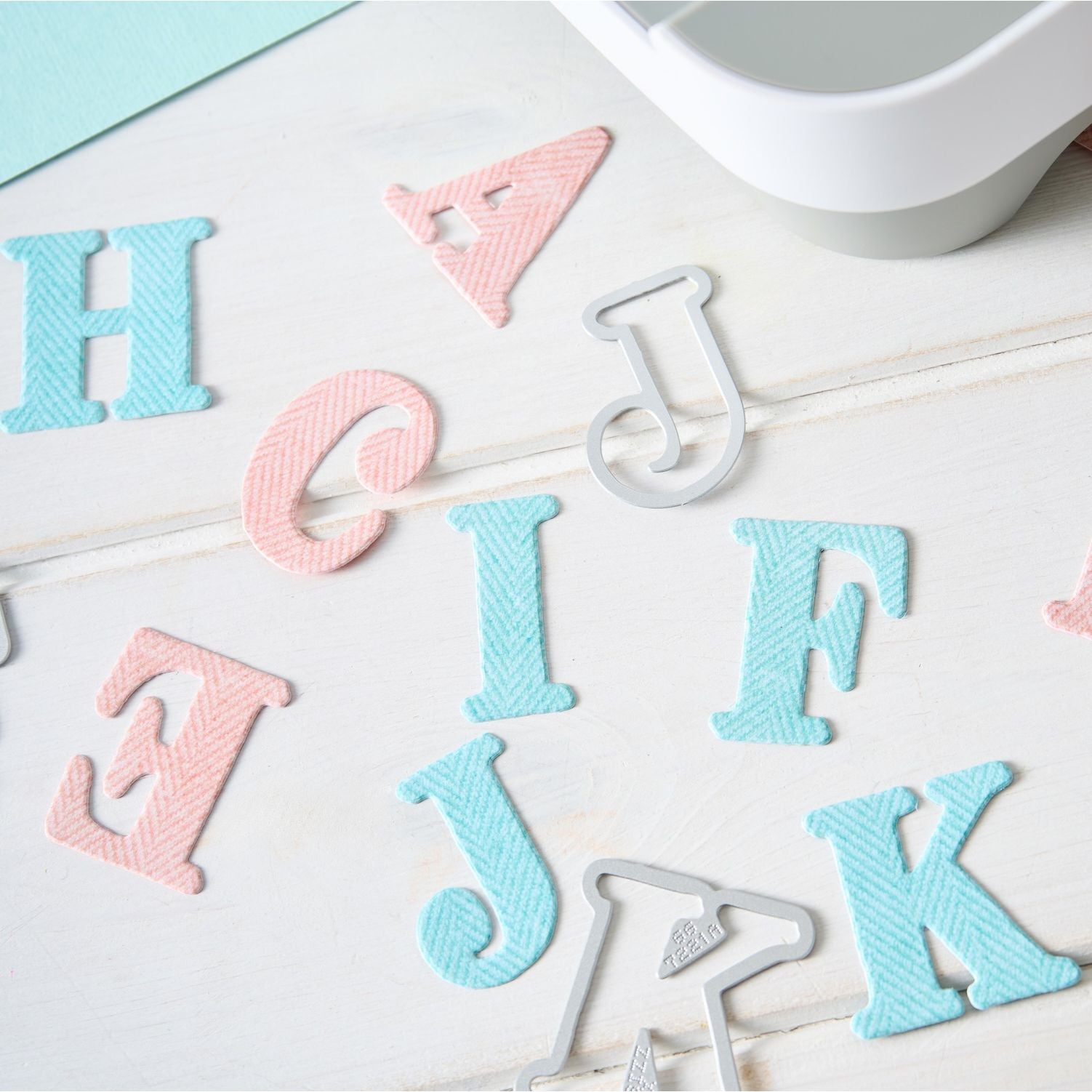 Sizzix and 49 and Market Lino Type Revival Thinlits Dies 667221 pink and blue letters