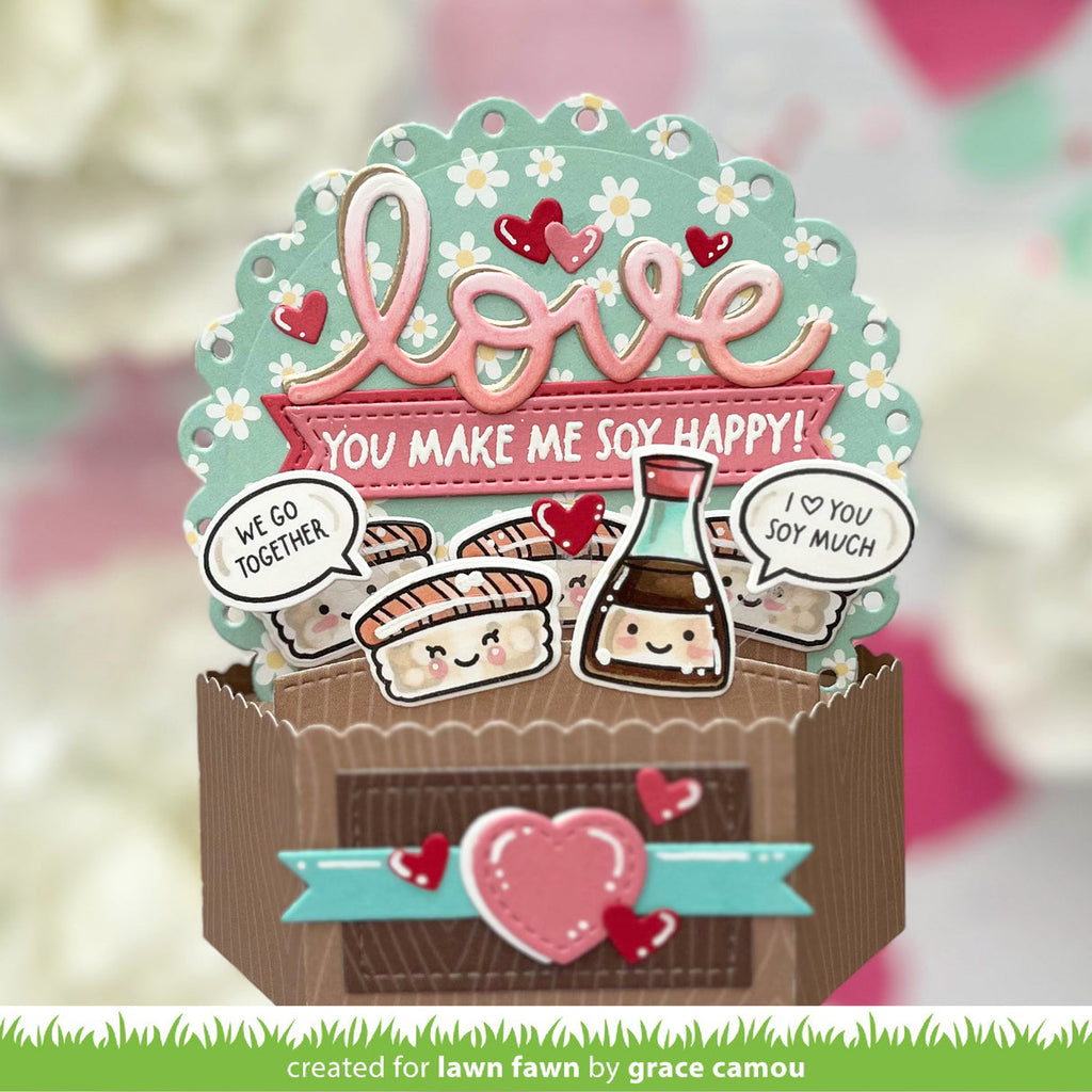 Decorative card with 'love' and cartoon sushi characters on a blurred background