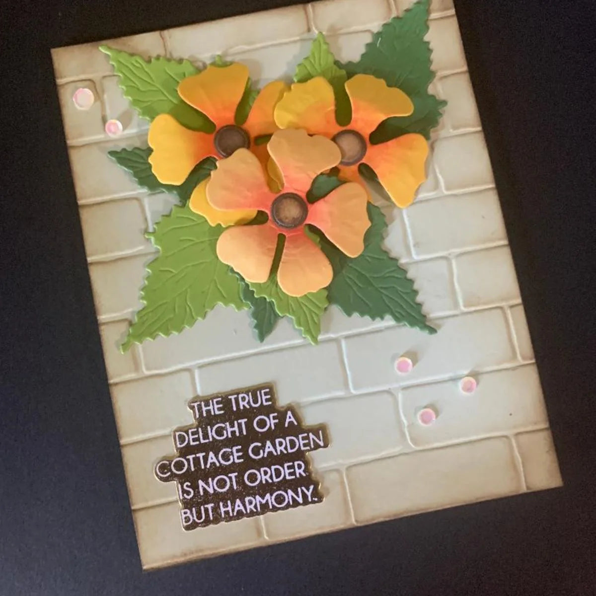 Spellbinders Black Eyed-Susan Vine Etched Dies s3-589 yellow and orange flowers brick background card joanne maddi