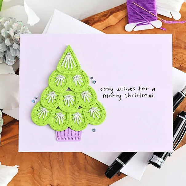 Spellbinders Oh Christmas Stitch Etched Dies s4-1558 green tree with white stitching purple base merry christmas card