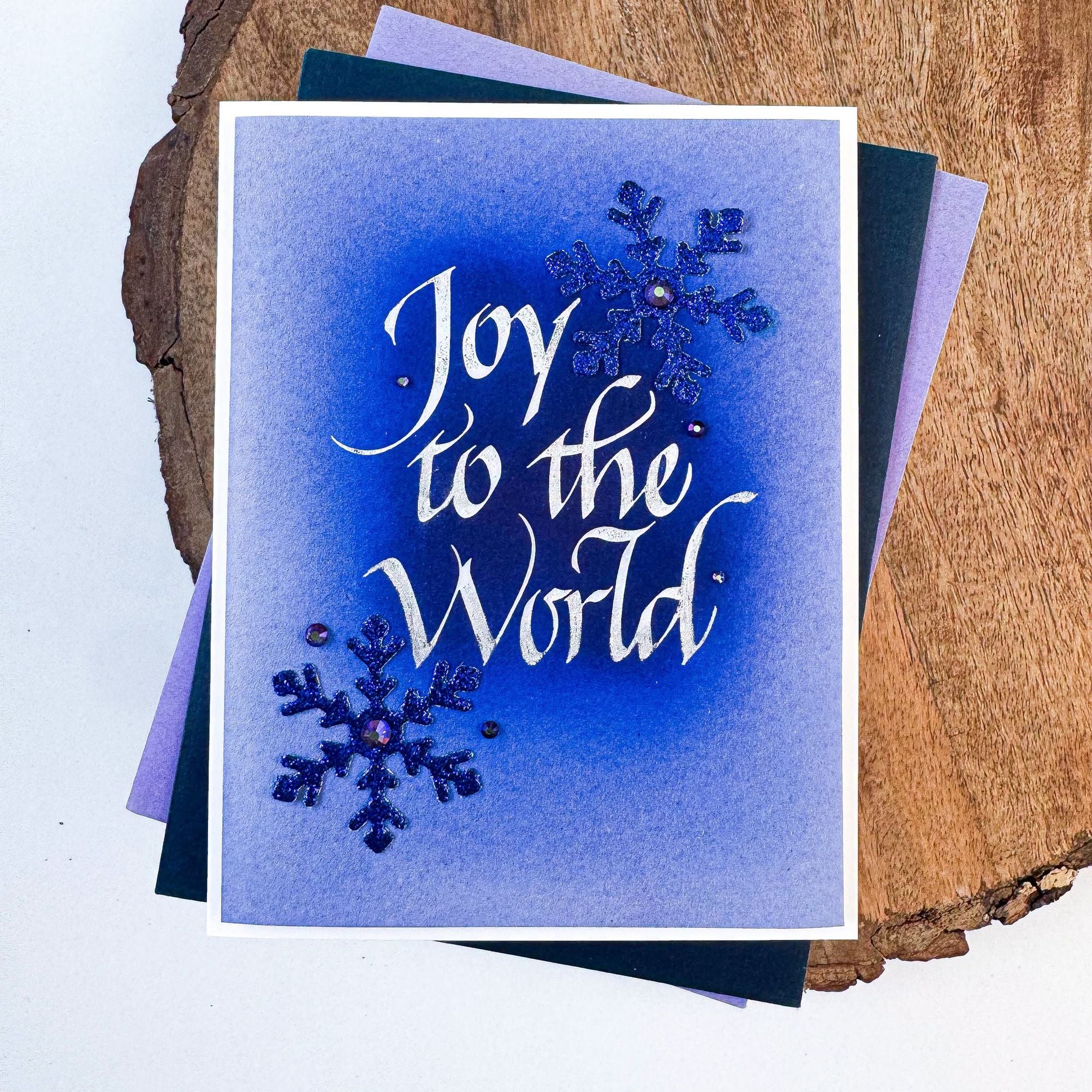 Spellbinders Upright Italic Joy to the World Press and Foil Plate bp-369 blue snowflakes with blue background card