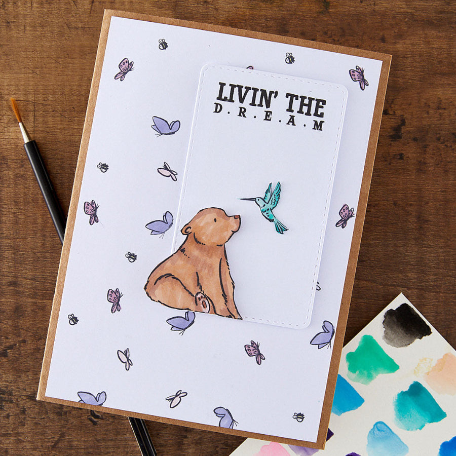 Spellbinders Wild Friends Clear Stamp Set stp-286 bear with hummingbird butterfly background livin the dream card