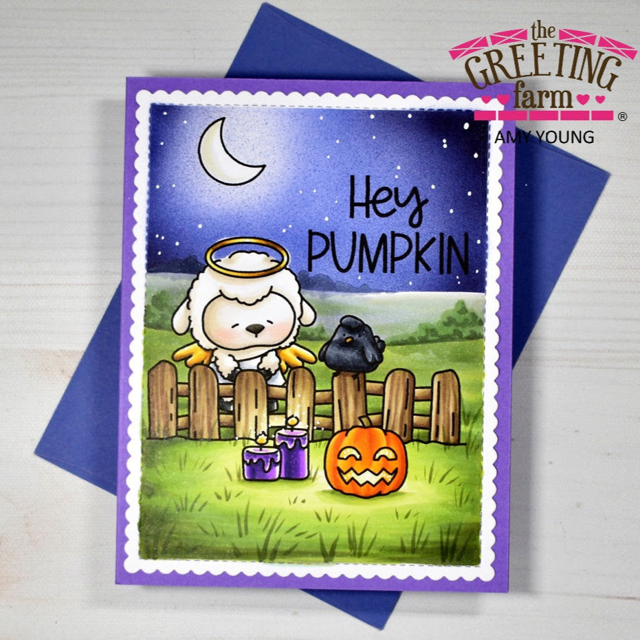 Halloween-themed greeting card with a sheep, pumpkin, and black cat on a purple border, featuring 'The Greeting Farm' brand.