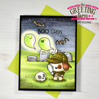 Halloween-themed card with a dog, ghosts, and bats on a green envelope.