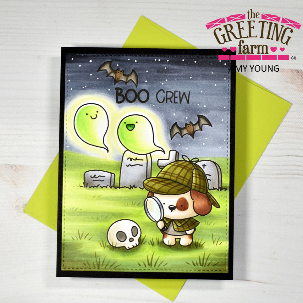 Halloween-themed card with a dog, ghosts, and bats on a green envelope.