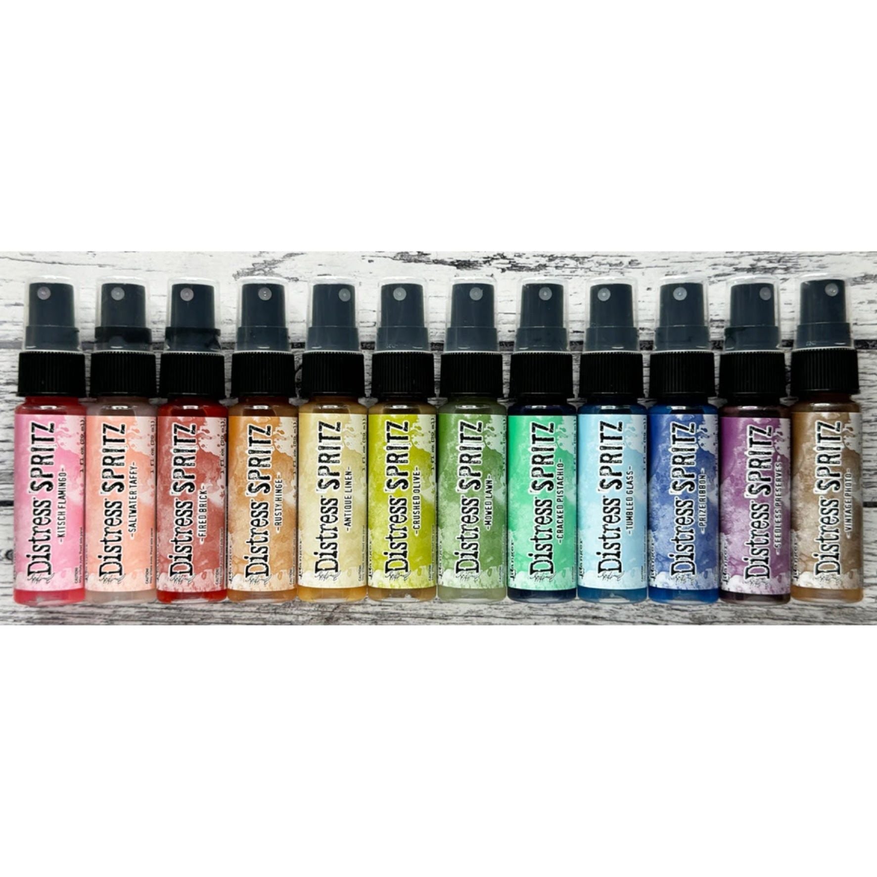Tim Holtz Medium 6 x 10 Distress Zipper Bag And Distress Spritz Bundle 2 rainbow line up on woodgrain