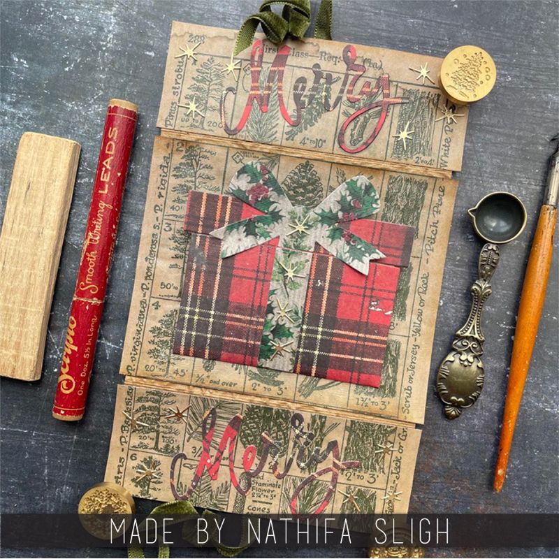 Tim Holtz Sizzix Merry & Bright Thinlits Dies 664739 present