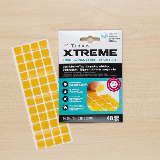 Tombow Xtreme Clear Adhesive Tabs 62134 being applied to project with package detail shown