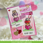 Valentine's Day card with cartoon animals holding hearts and 'Happy Heart Day!' text on a pink background.

