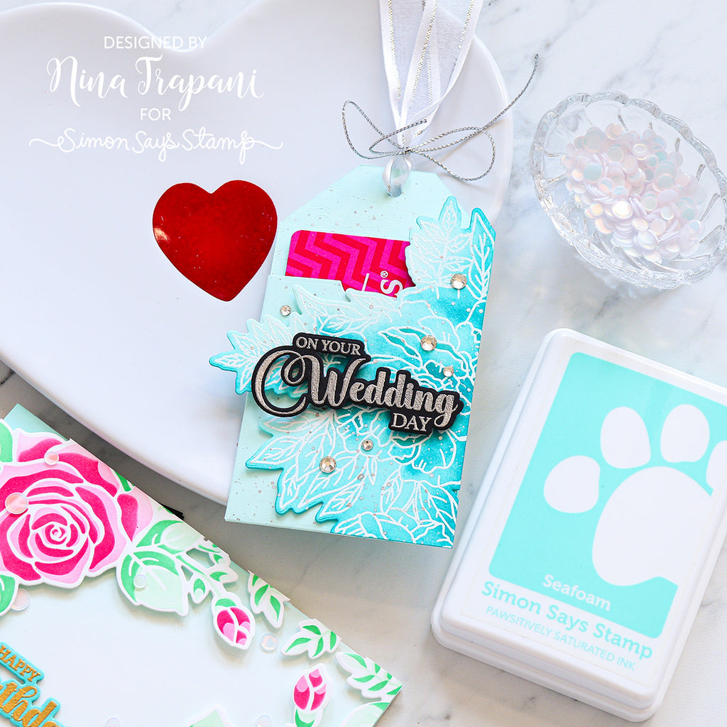 Wedding-themed tag with 'On Your Wedding Day' design on a white surface.
