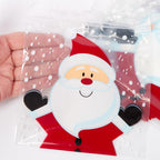 Clear plastic bag with a Santa Claus design held by a hand against a snowy background.
